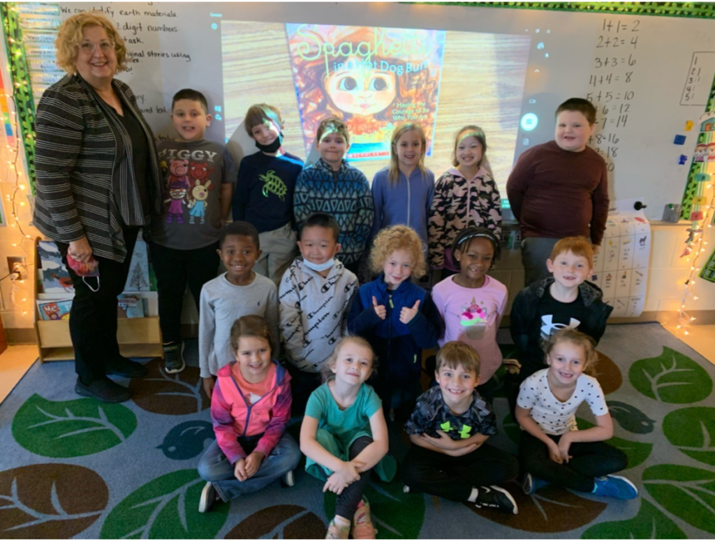 Dodi at Burgess Elementary with Ms. Elliot's Grade 1 classroom through a Literacy Day sponsored by United Way and the Myrtle Beach Area Chamber of Com- merce. She read "Spaghetti in a Hot Dog Bun" to the students.