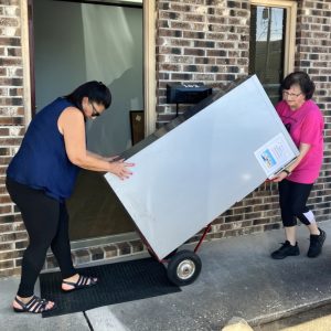 Moving a refrigerator.